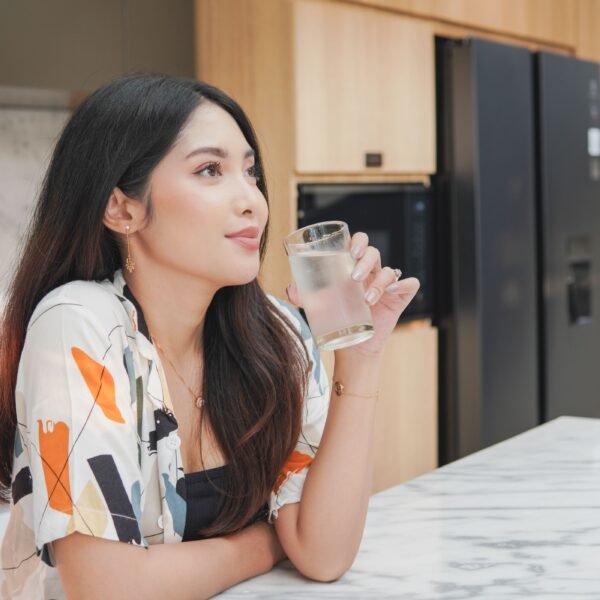 A woman enjoy drinking cold water